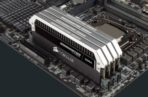 The image shows a set of two Corsair Vengeance LPX DDR4 RAM modules installed on a motherboard. The RAM modules are black with a white heat spreader and have the Corsair Vengeance logo on them.